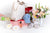 flowers, a leather bag, a baseball hat, shoes, wine, and various other gifts for mother's day against a white background